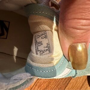 Light teal low top vans in good condition.